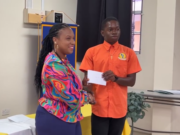 The Rotary Club of Dominica presents scholarships to three young men of the Dominica State College