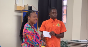 The Rotary Club of Dominica presents scholarships to three young men of the Dominica State College